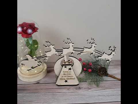 Rocking santa claus and deers christmas decoration with custom saying