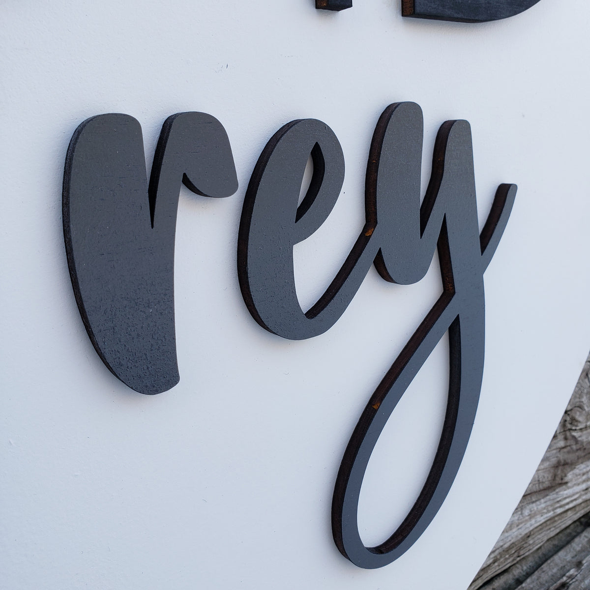 Personalized bear baby name sign displayed on a nursery wall